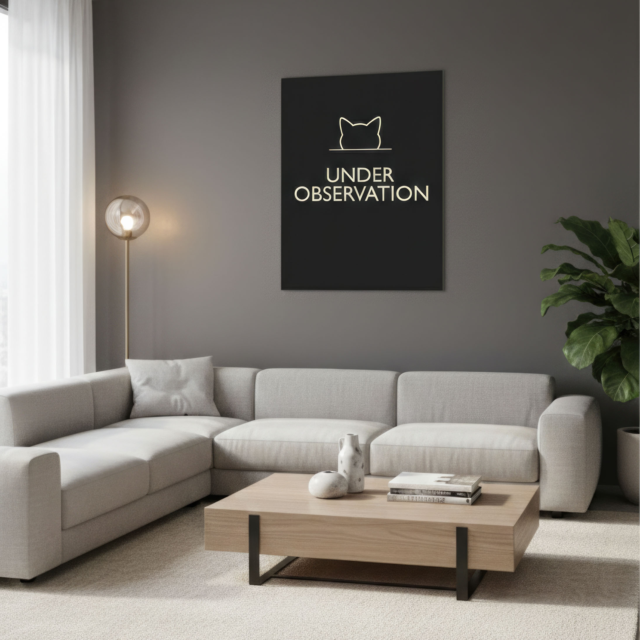 UNDER OBSERVATION typography poster above desk in workspace